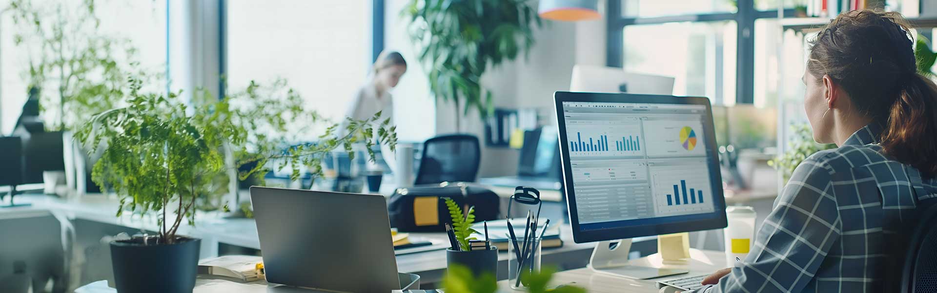 Woman sat at the desk looking at the Data Driven Decisions: Navigating Modern Business - Analyzing Success: Metrics That Matter