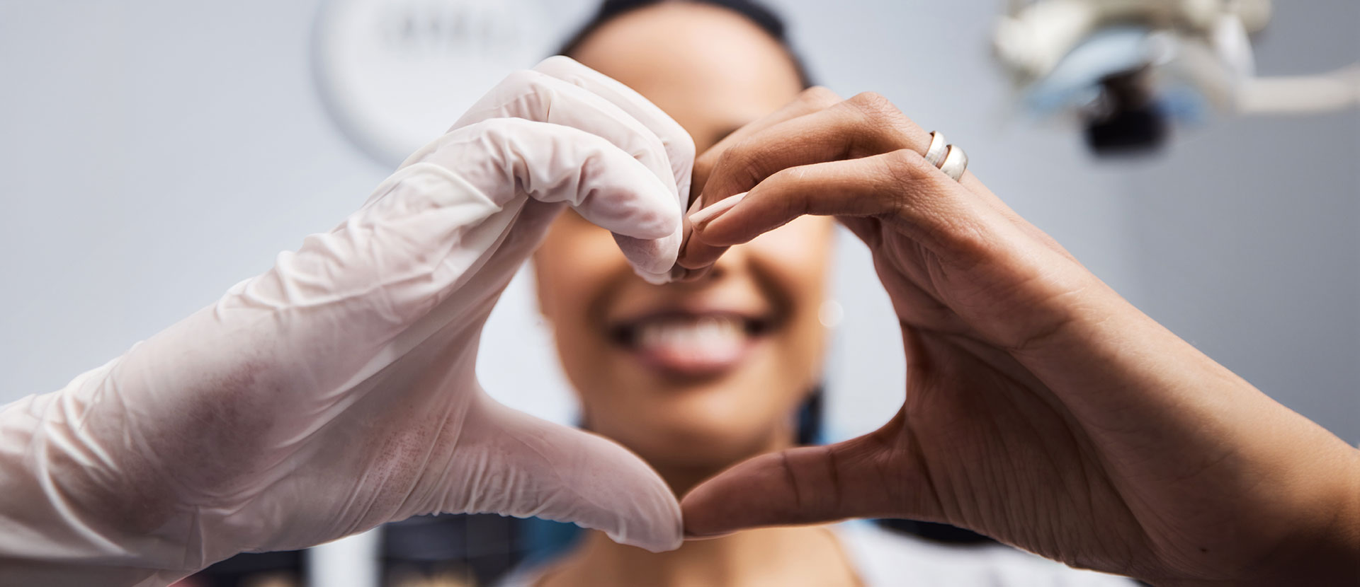 We love to see you smile just like you do. Cropped shot of a healthcare worker and patient making a heart shaped gesture with their hands.