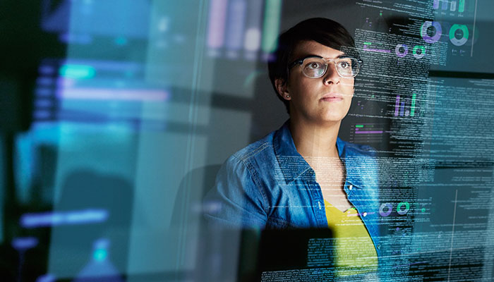Making progress on her code. Cropped shot of a young computer programmer looking through data.
